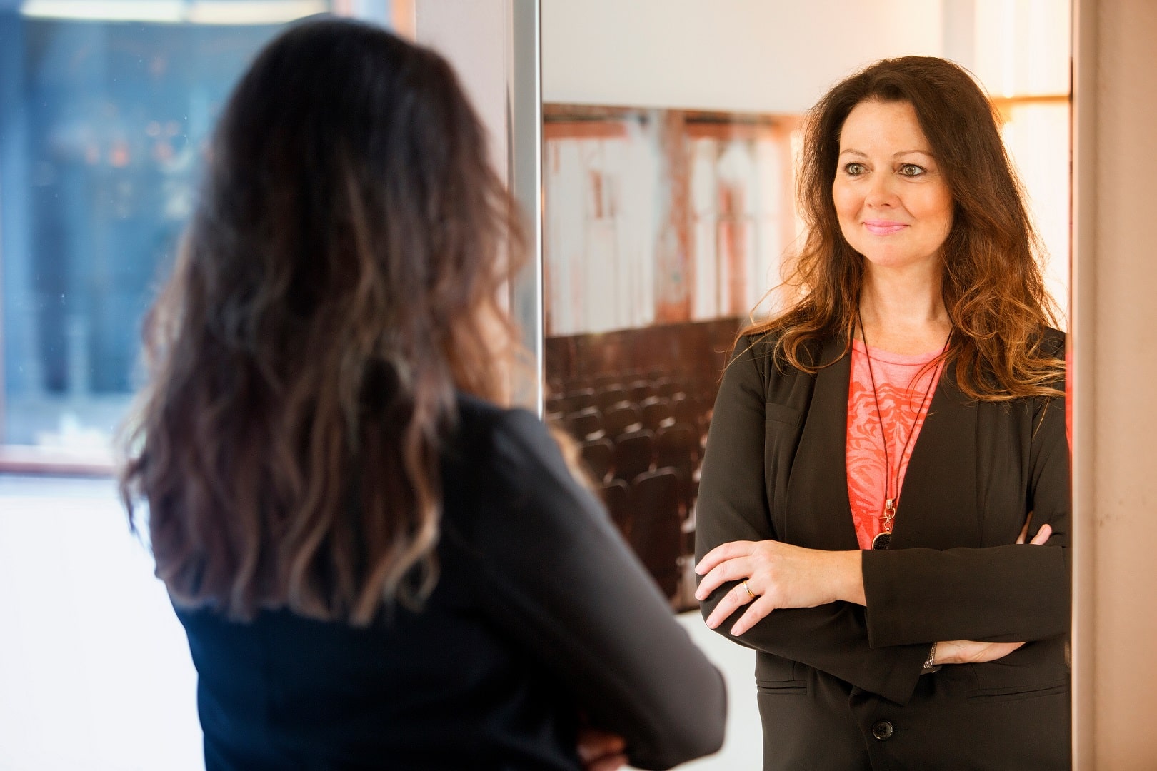 woman-looking-at-herself-in-mirror-reflection