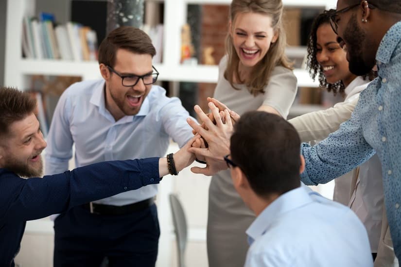 Diverse team high-fiving