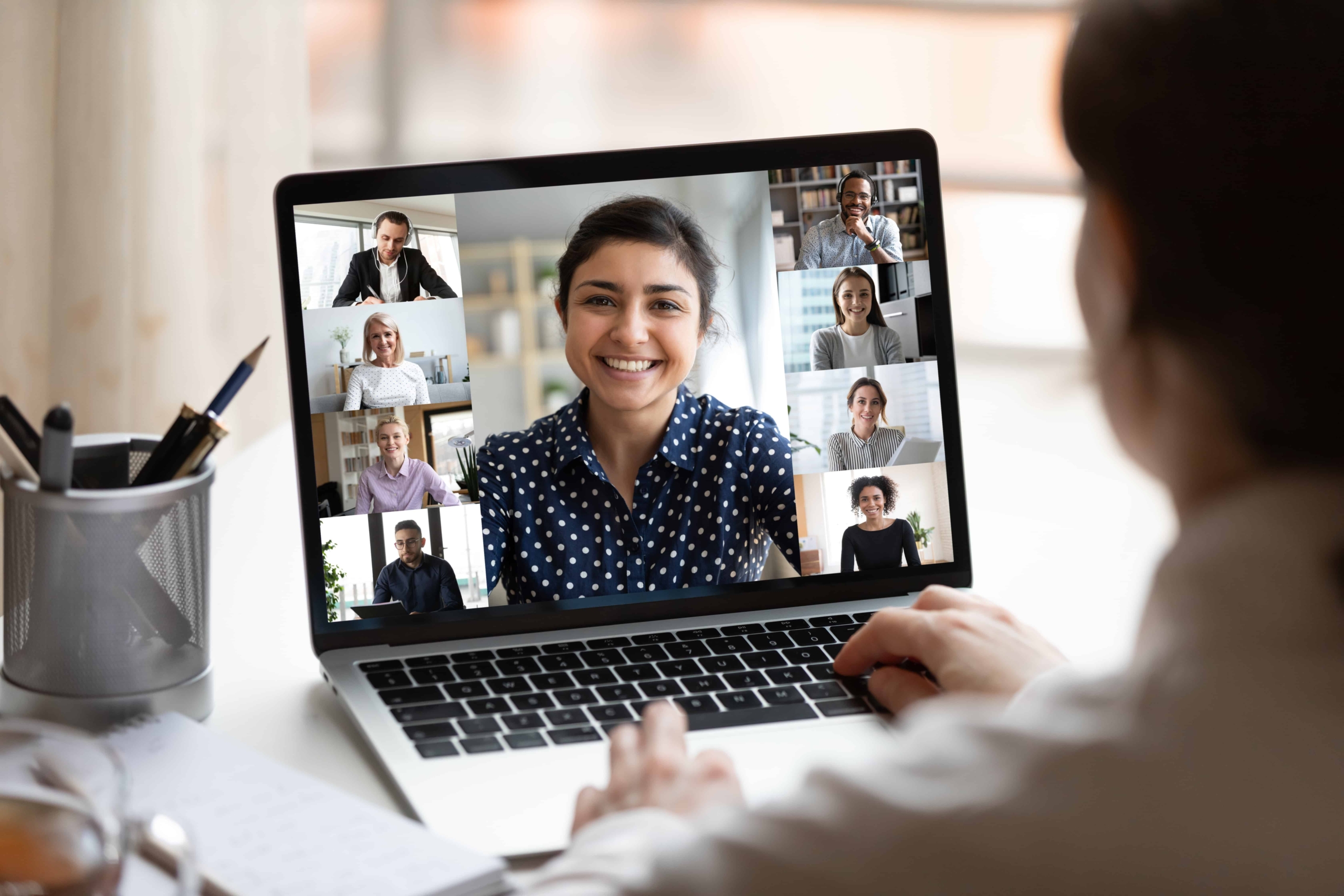 Indian lady lead videocall, pc screen view over woman shoulder