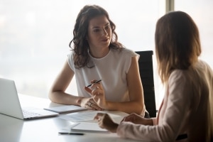 Two women discussing 360 feedback