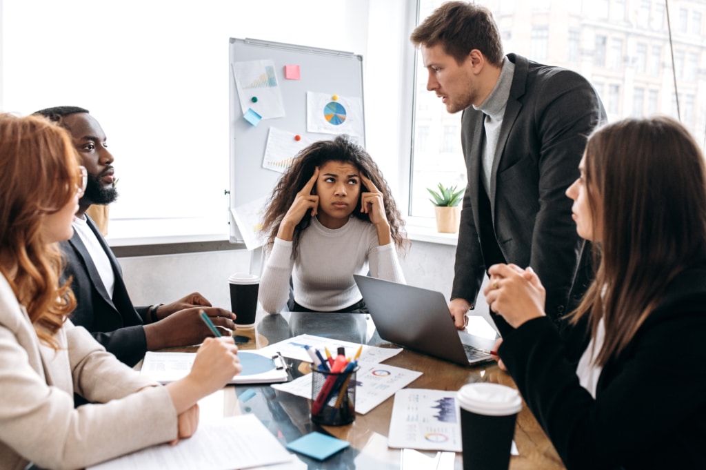 frustrated coworkers in a meeting