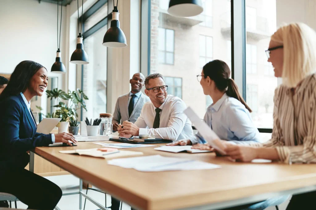 Smiling business professionals collaborating in a bright modern office
