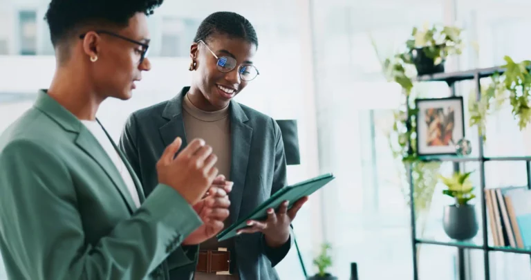 Two co-workers discussing assessment results